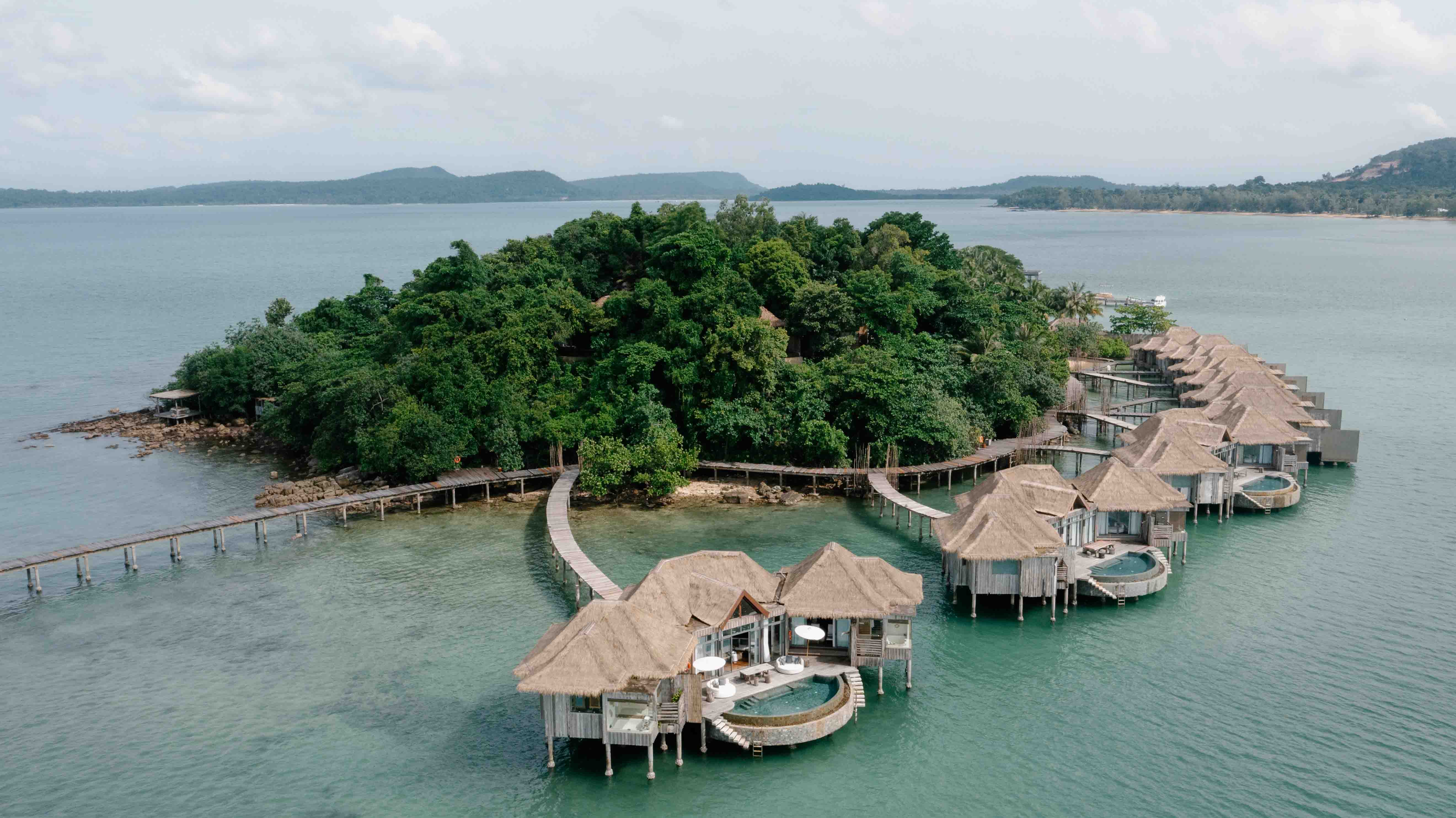 Drone Shot of Song Saa Private Island, Cambodia Drone shot of Song Saa Private Island luxury eco resort in Cambodia’s Koh Rong Archipelago, featuring turquoise waters and lush tropical scenery.
